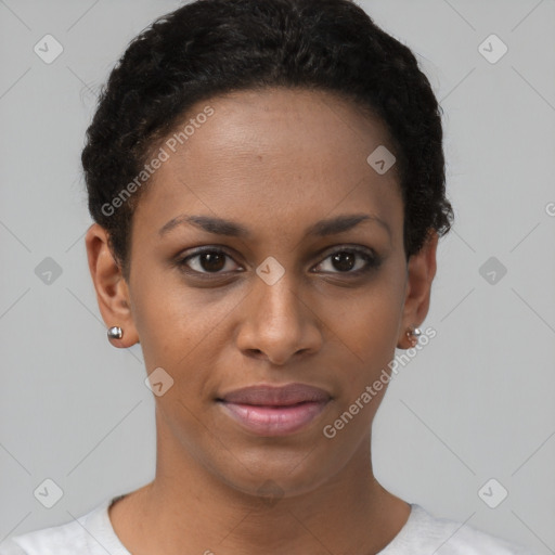 Joyful black young-adult female with short  brown hair and brown eyes