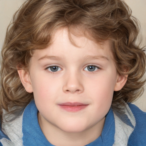 Joyful white child male with medium  brown hair and blue eyes