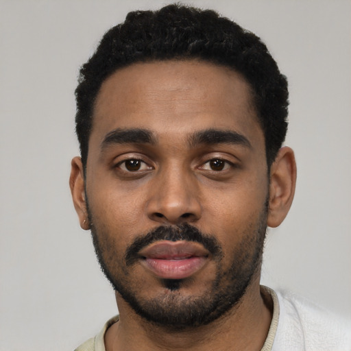 Neutral black young-adult male with short  black hair and brown eyes