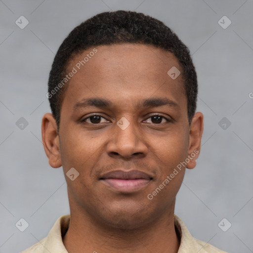 Joyful latino young-adult male with short  brown hair and brown eyes