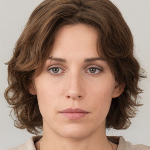 Neutral white young-adult female with medium  brown hair and green eyes