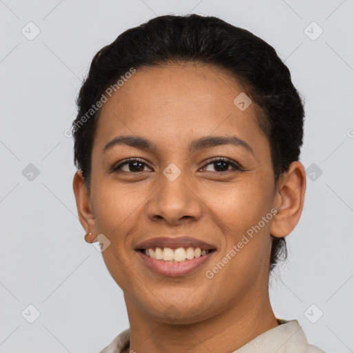 Joyful latino young-adult female with short  black hair and brown eyes