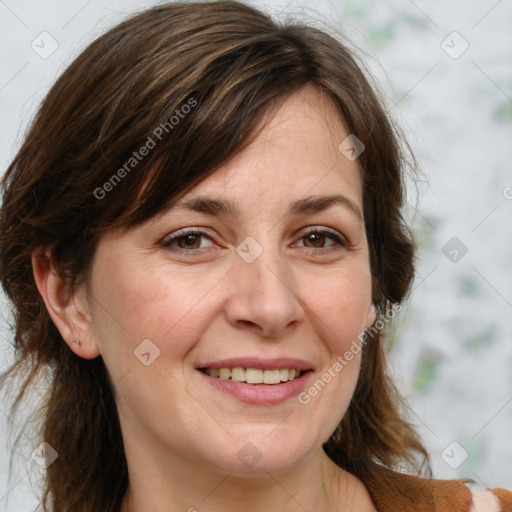 Joyful white adult female with medium  brown hair and blue eyes