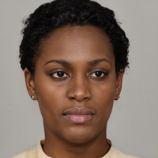 Neutral black young-adult female with short  black hair and brown eyes