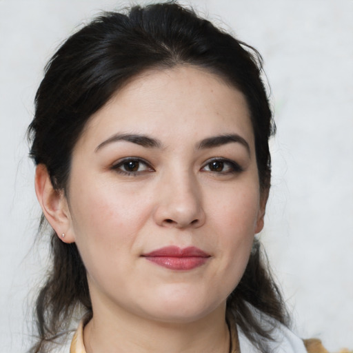 Joyful white young-adult female with medium  brown hair and brown eyes