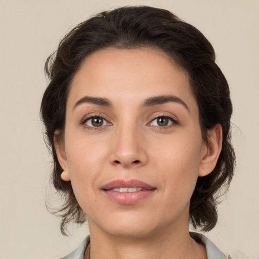 Joyful white young-adult female with medium  brown hair and brown eyes