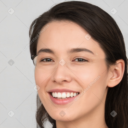 Joyful white young-adult female with medium  brown hair and brown eyes