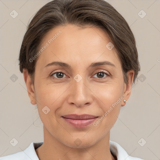 Joyful white adult female with short  brown hair and brown eyes