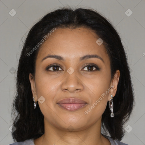 Joyful black young-adult female with long  brown hair and brown eyes