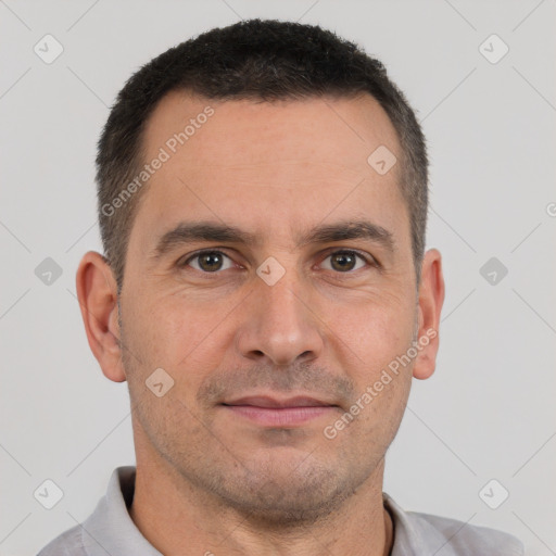 Joyful white adult male with short  brown hair and brown eyes