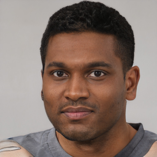 Neutral black young-adult male with short  black hair and brown eyes