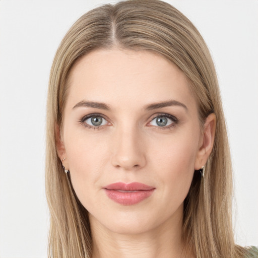 Joyful white young-adult female with long  brown hair and green eyes