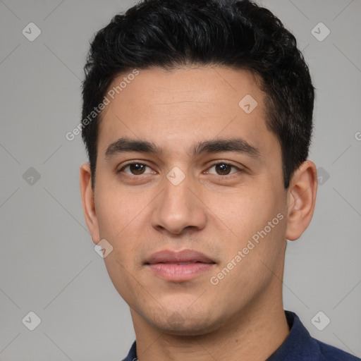 Joyful white young-adult male with short  black hair and brown eyes