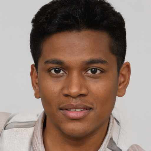 Joyful latino young-adult male with short  brown hair and brown eyes