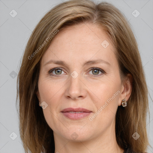 Joyful white adult female with medium  brown hair and grey eyes