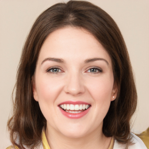 Joyful white young-adult female with medium  brown hair and brown eyes