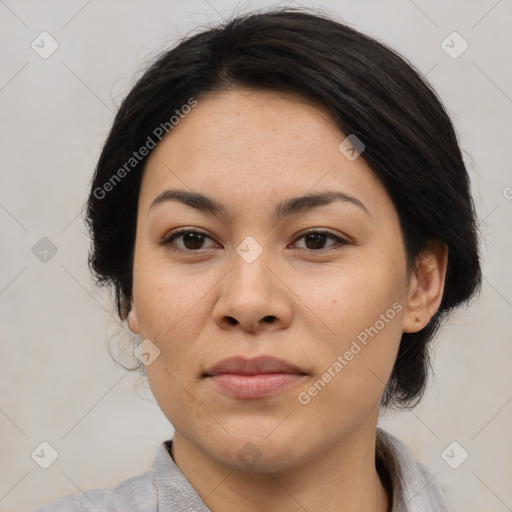 Joyful asian young-adult female with medium  brown hair and brown eyes