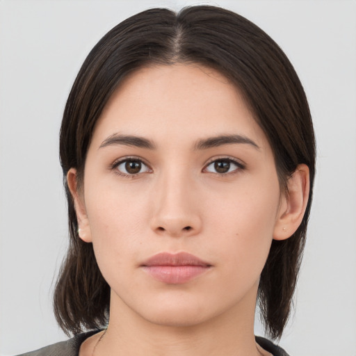 Neutral asian young-adult female with medium  brown hair and brown eyes