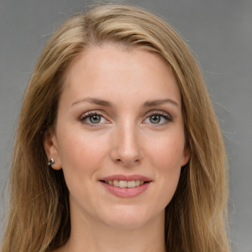 Joyful white young-adult female with long  brown hair and grey eyes