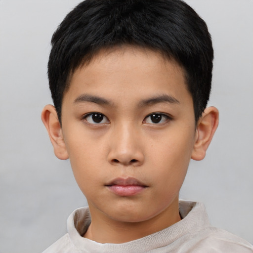 Neutral asian child male with short  brown hair and brown eyes