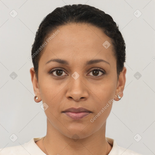 Joyful latino young-adult female with short  brown hair and brown eyes