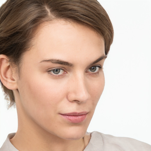 Neutral white young-adult female with short  brown hair and brown eyes