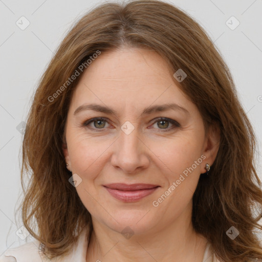 Joyful white adult female with long  brown hair and brown eyes