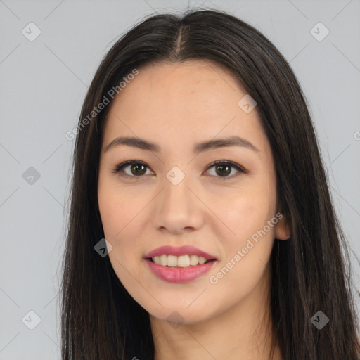 Joyful asian young-adult female with long  brown hair and brown eyes