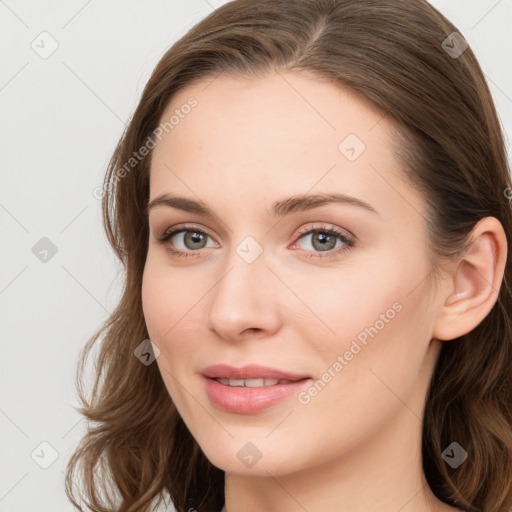 Joyful white young-adult female with long  brown hair and blue eyes