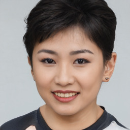 Joyful asian young-adult female with short  brown hair and brown eyes