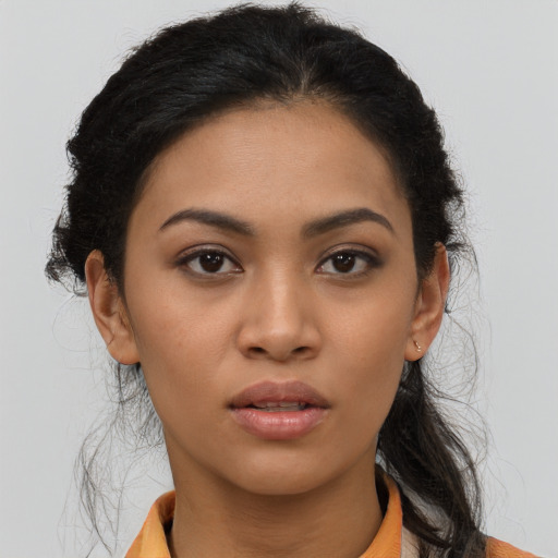 Neutral latino young-adult female with medium  brown hair and brown eyes