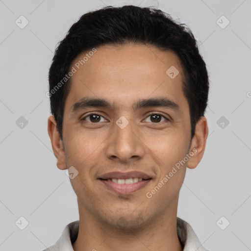 Joyful latino young-adult male with short  black hair and brown eyes