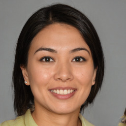 Joyful white young-adult female with medium  brown hair and brown eyes