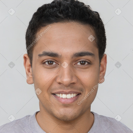 Joyful latino young-adult male with short  brown hair and brown eyes