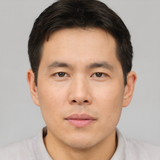 Neutral asian young-adult male with short  brown hair and brown eyes