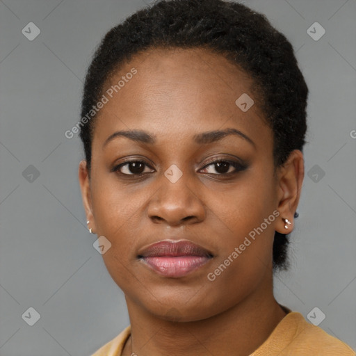 Joyful black young-adult female with short  brown hair and brown eyes