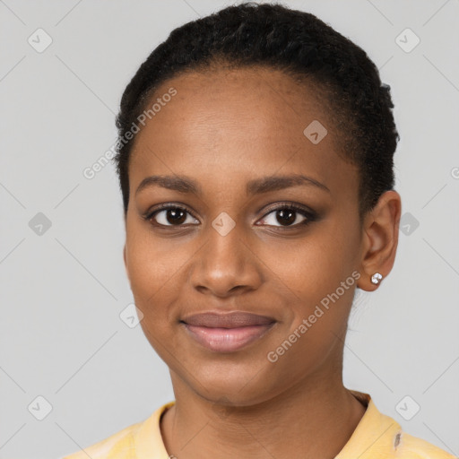 Joyful black young-adult female with short  black hair and brown eyes