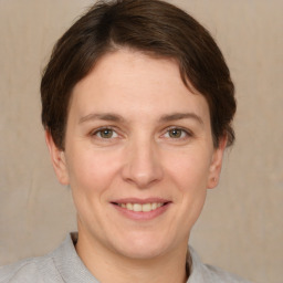 Joyful white adult female with short  brown hair and brown eyes