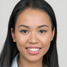 Joyful white young-adult female with long  black hair and brown eyes