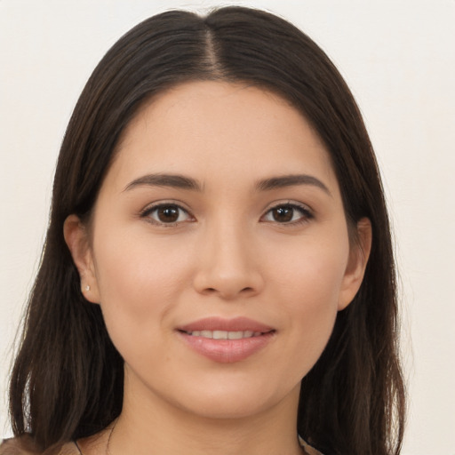 Joyful asian young-adult female with long  brown hair and brown eyes