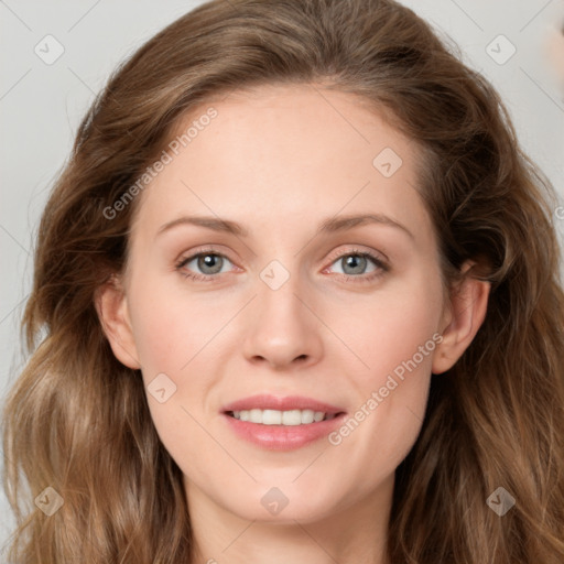 Joyful white young-adult female with long  brown hair and green eyes