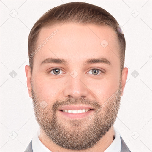 Joyful white young-adult male with short  brown hair and grey eyes