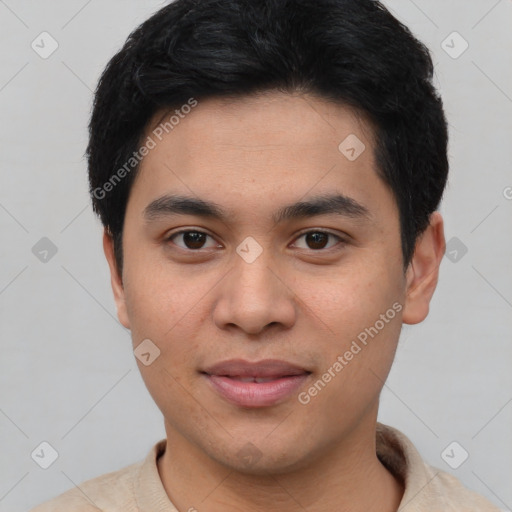 Joyful asian young-adult male with short  black hair and brown eyes