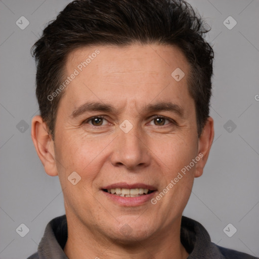 Joyful white adult male with short  brown hair and brown eyes