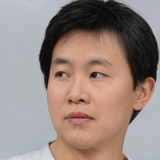 Neutral asian young-adult male with short  brown hair and brown eyes