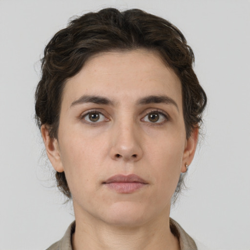 Neutral white young-adult female with short  brown hair and brown eyes