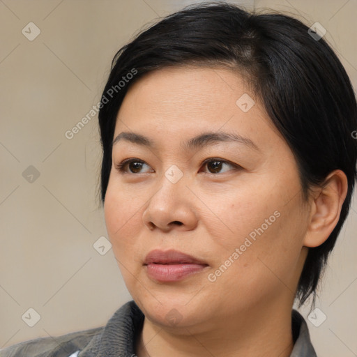 Joyful white adult female with medium  brown hair and brown eyes