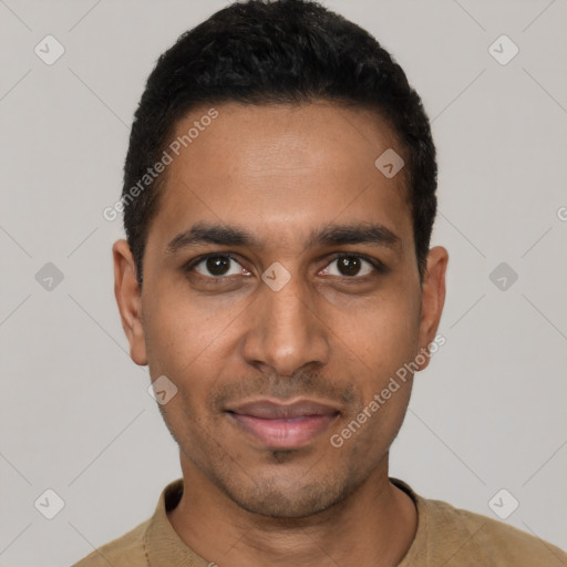 Joyful latino young-adult male with short  black hair and brown eyes