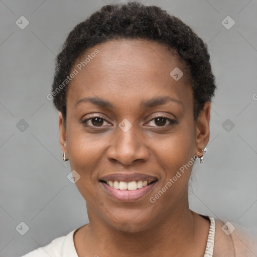 Joyful black young-adult female with short  brown hair and brown eyes