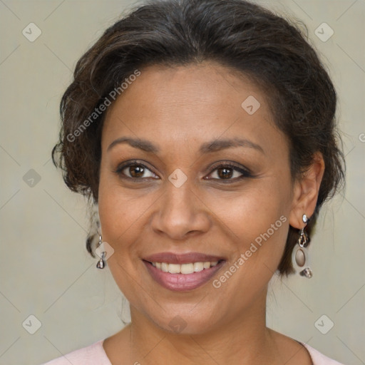 Joyful black adult female with medium  brown hair and brown eyes